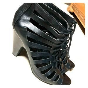 Caged black ankle bootie